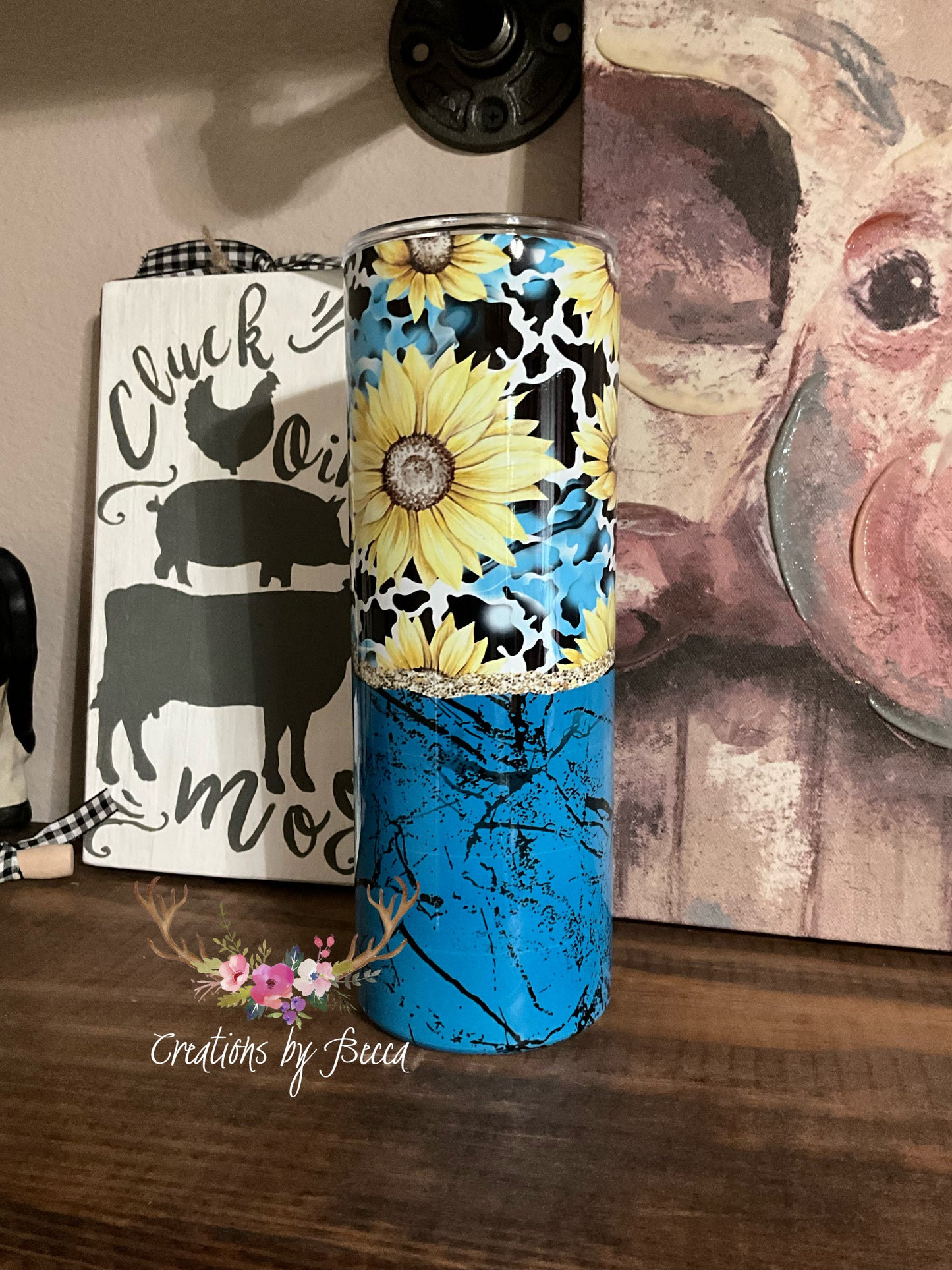 Teal sunflower and cow print tumbler